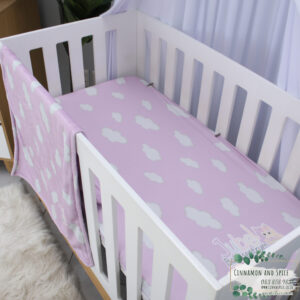 Luxury custom toddler fitted sheet South Africa – soft breathable fabric, handmade by Cinnamon & Spice. Purple with Clouds