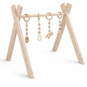 Minimalist natural wooden baby gym with hanging wooden toys on white background