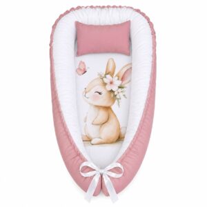 Pink Soft Watercolour Girly Bunny baby nest with padded raised sides and a small matching head pillow, designed to create a cozy, secure sleeping space for infants.