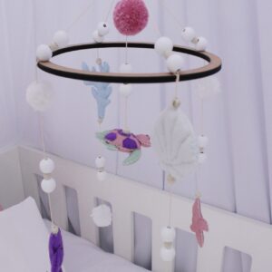 Cot mobile with handcrafted characters, perfect for adding classic charm to your baby’s nursery – Cinnamon and Spice Baby Boutique.