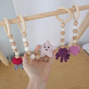 Baby Gym – Themed Dangles – Purple Under The Sea | Cinnamon & Spice South Africa Natural wooden baby gym with minimalist wooden dangles hanging from frame. Brand: Cinnamon and Spice