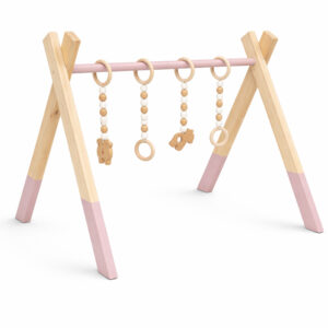 Minimalist natural wooden baby gym with hanging wooden toys on white background