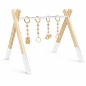Minimalist natural wooden baby gym with hanging wooden toys on white background