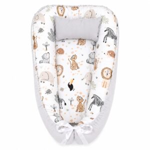 Dotty Drawing Wolf Hedgehog baby nest with padded raised sides and a small matching head pillow, designed to create a cozy, secure sleeping space for infants.
