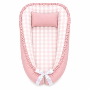 Checkered Pink and Beige baby nest with padded raised sides and a small matching head pillow, designed to create a cozy, secure sleeping space for infants.