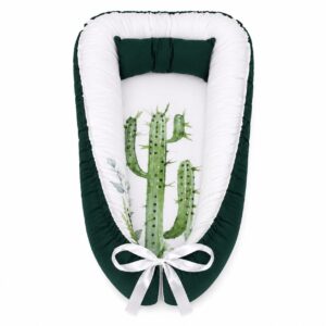 Pennygum Cactus Sage Green baby nest with padded raised sides and a small matching head pillow, designed to create a cozy, secure sleeping space for infants.