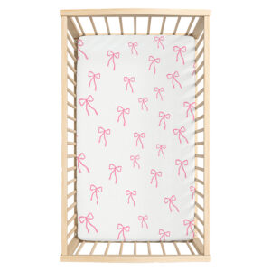 Bows Pink | Fitted Sheet | Cinnamon & Spice South Africa Soft, breathable baby cot fitted sheets in various designs and sizes, ensuring a snug fit for your crib mattresses. Custom made for you by Cinnamon and Spice