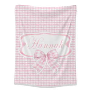 Pink Checkered Bow Fleece Blanket | Cinnamon & Spice South Africa Soft blush pink gingham bow fleece blanket with customized designs, perfect for baby snuggles and nursery coziness