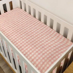Checkered Gingham Pink and Light Beige | Fitted Sheet | Cinnamon & Spice South Africa Soft, breathable baby cot fitted sheets in various designs and sizes, ensuring a snug fit for your crib mattresses. Custom made for you by Cinnamon and Spice